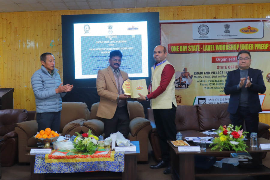 Government officials presenting PMEGP benefits