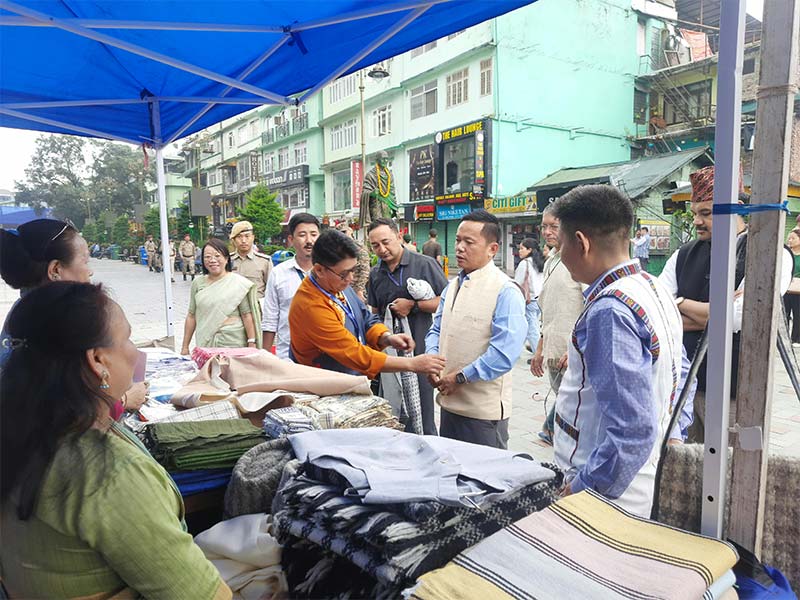 Visitors browsing Khadi textiles