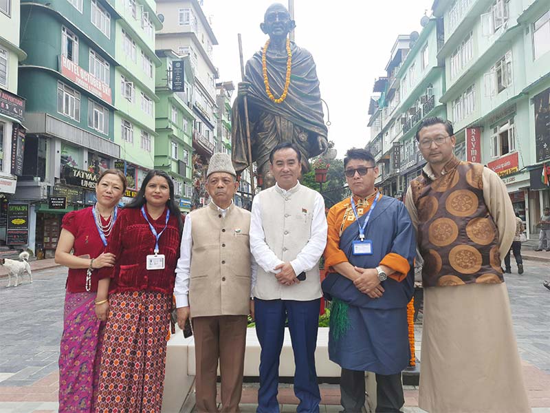 Members at the Mahatma Gandhi statue