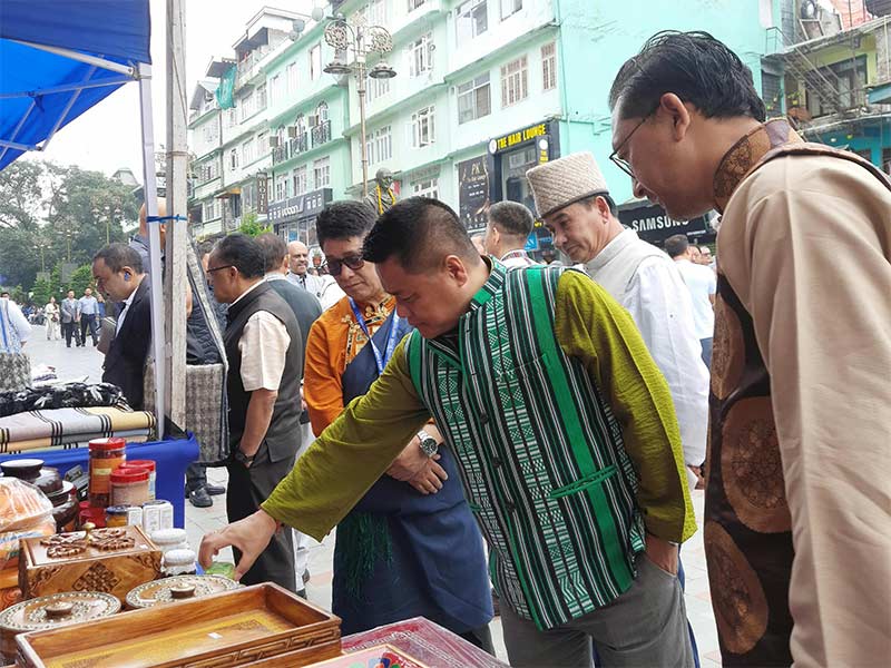 Visitors looking at traditional handicrafts